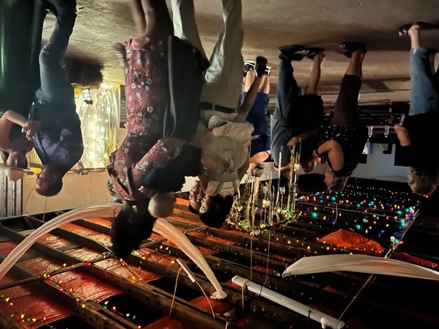 Campers dancing at a decorated park dance